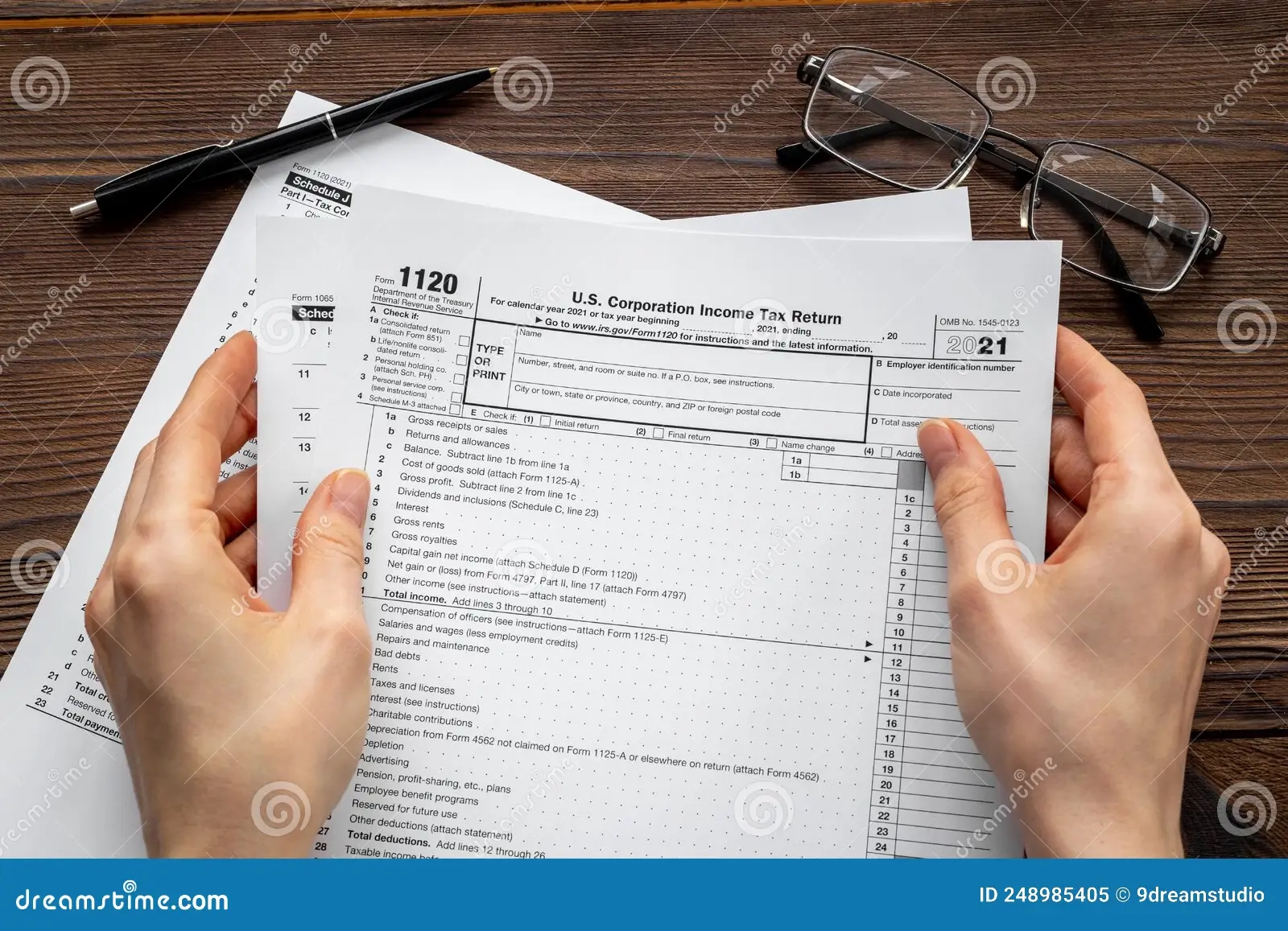 Accountant Culculate Taxes US Tax Form On Office Table Desktop 